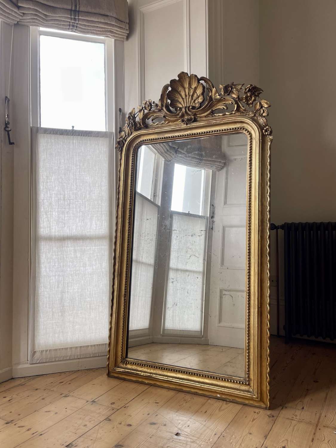 Large 19th century French gilt leaner mirror mercury glass