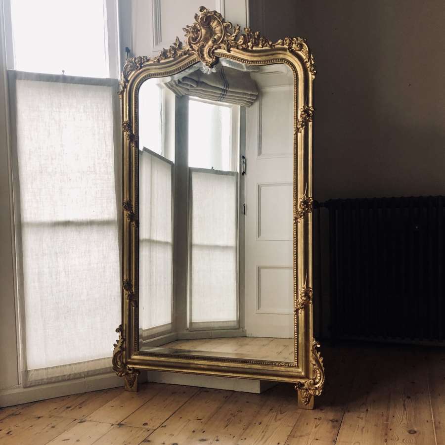 Antique French Louis XV crested gilt leaner mirror