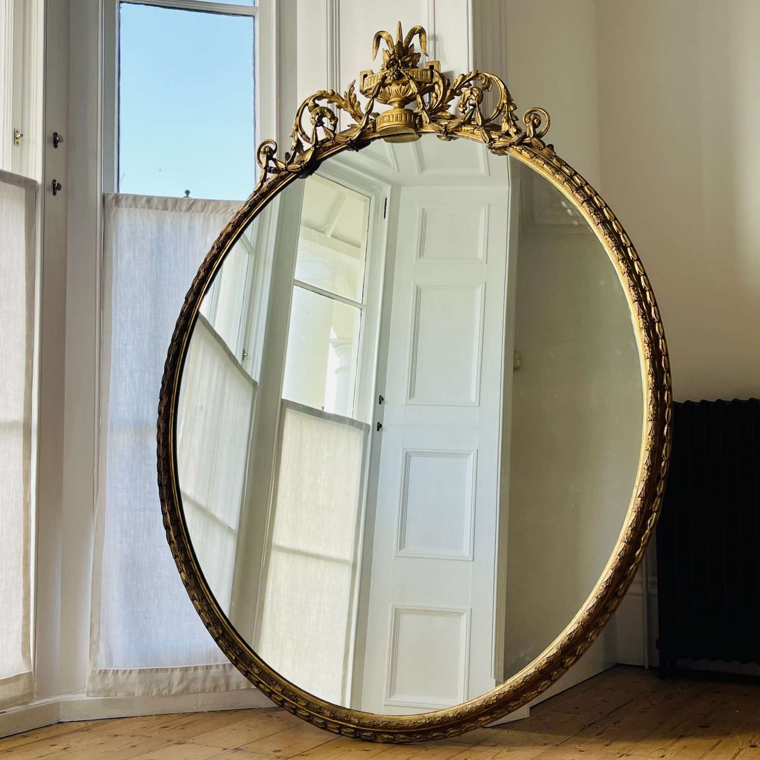 Large 19th century English  oval gilt mirror
