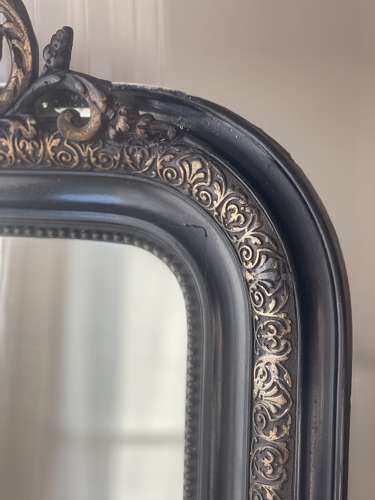 Large antique French ebonised and gilt mirror