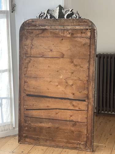 Large antique French ebonised and gilt mirror