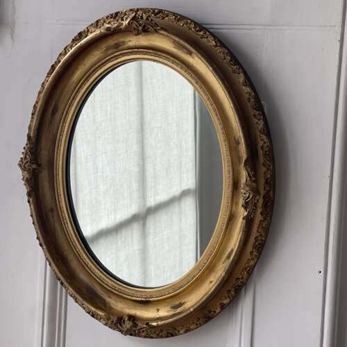 Antique French gilt oval mirror