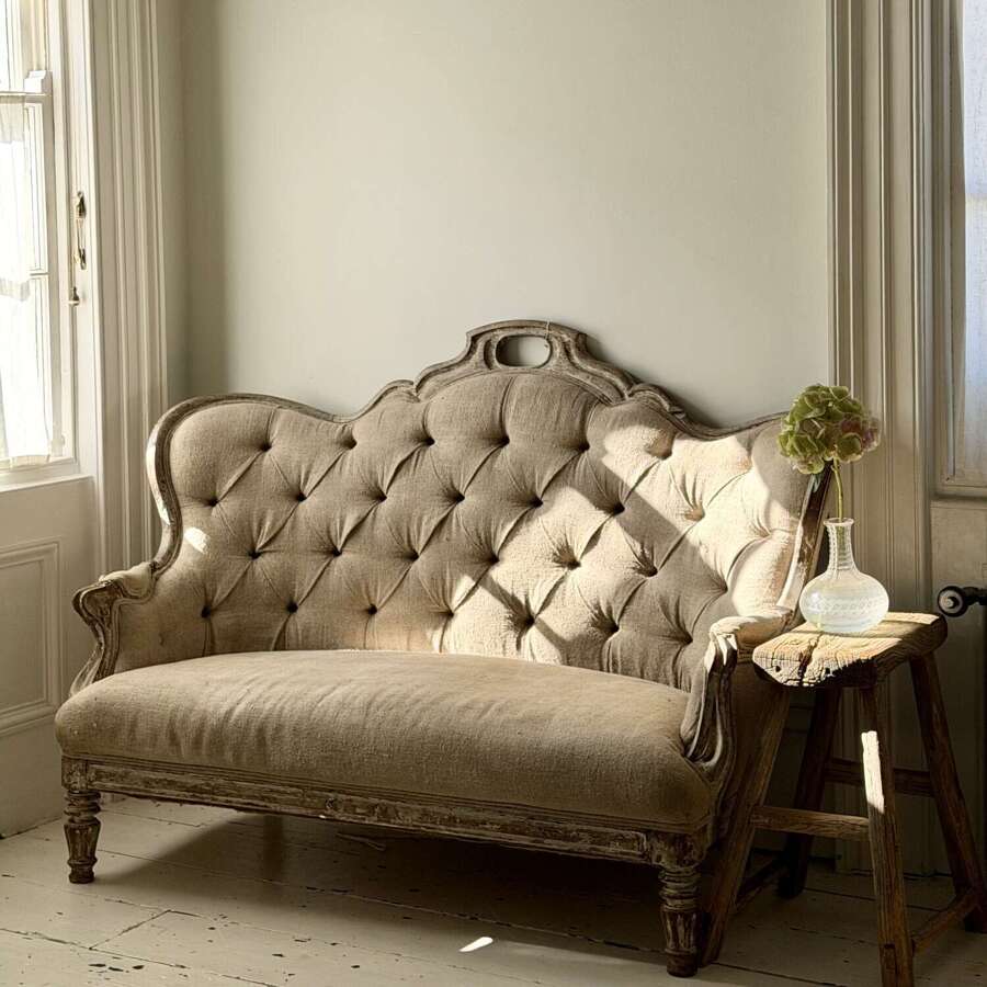 Antique French oak and linen button back sofa