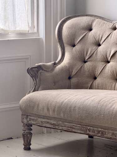 Antique French oak and linen button back sofa