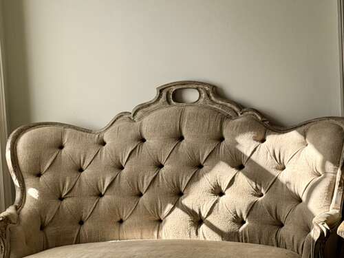 Antique French oak and linen button back sofa