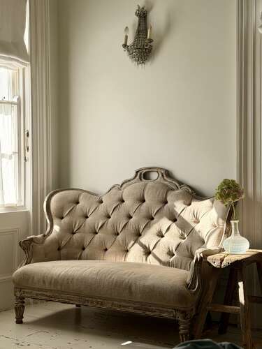 Antique French oak and linen button back sofa